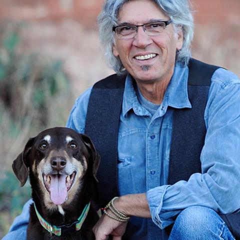 Cyrus Mejia with medium brown dog