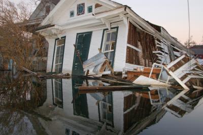 A flooded building following Hurricane Katrina that is collapsing