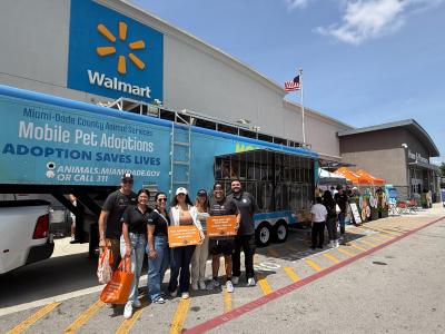 Group of people participating in the Bring Happy Home Walmart adoption event in Miami