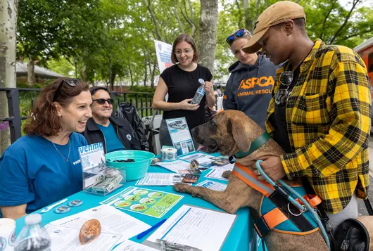 Group of people around a table at an event